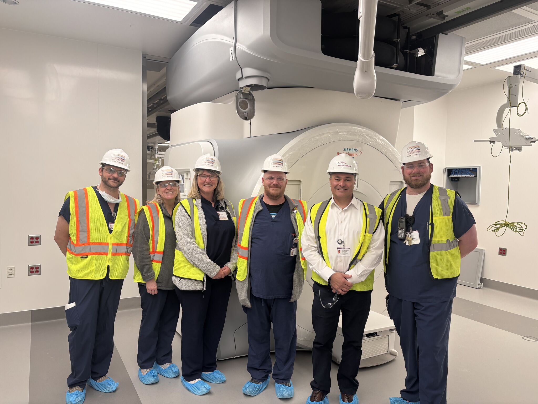 CIGNS Director Costas Hadjipanayis, MD, PhD, joins the UPMC Presbyterian construction and facilities team inside the new Kamin Tower neurosurgery suite, home to the department's shared intraoperative MRI. CIGNS Director Costas Hadjipanayis, MD, PhD, joins the UPMC Presbyterian construction and facilities team inside the new Kamin Tower neurosurgery suite, home to the department's shared intraoperative MRI.