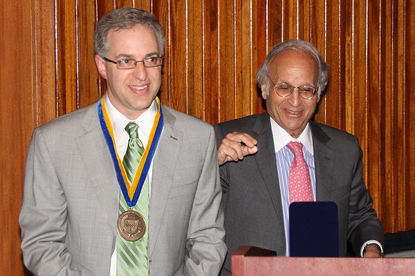 Peter Gerszten after receiving medal from Arthur S. Levine.