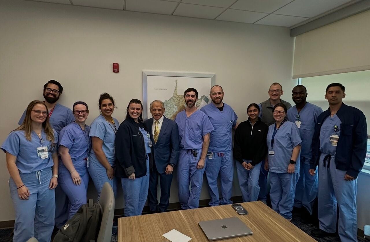 Dr. Maroon meeting with the neurosurgical residents at WVU